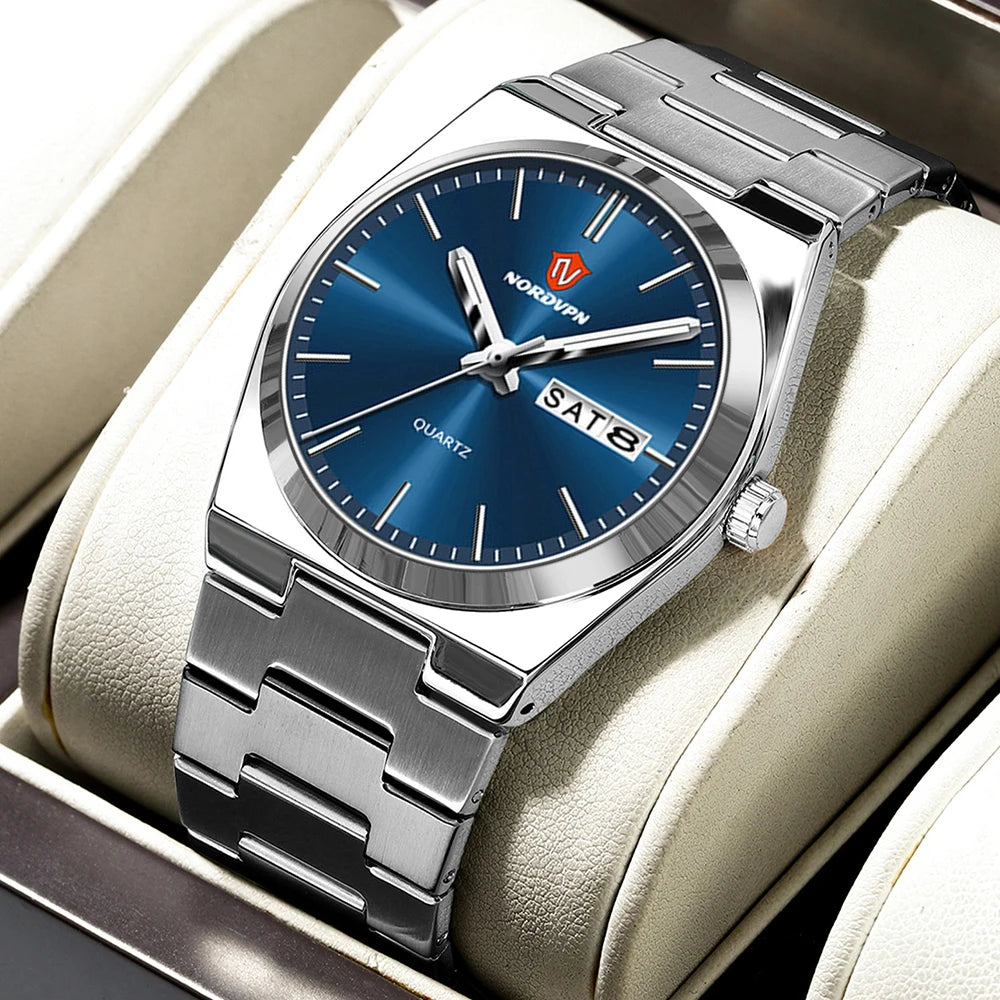 Ultra-thin silver-tone quartz watch with a blue sunray dial, baton indices, and a day-date display on a link bracelet.