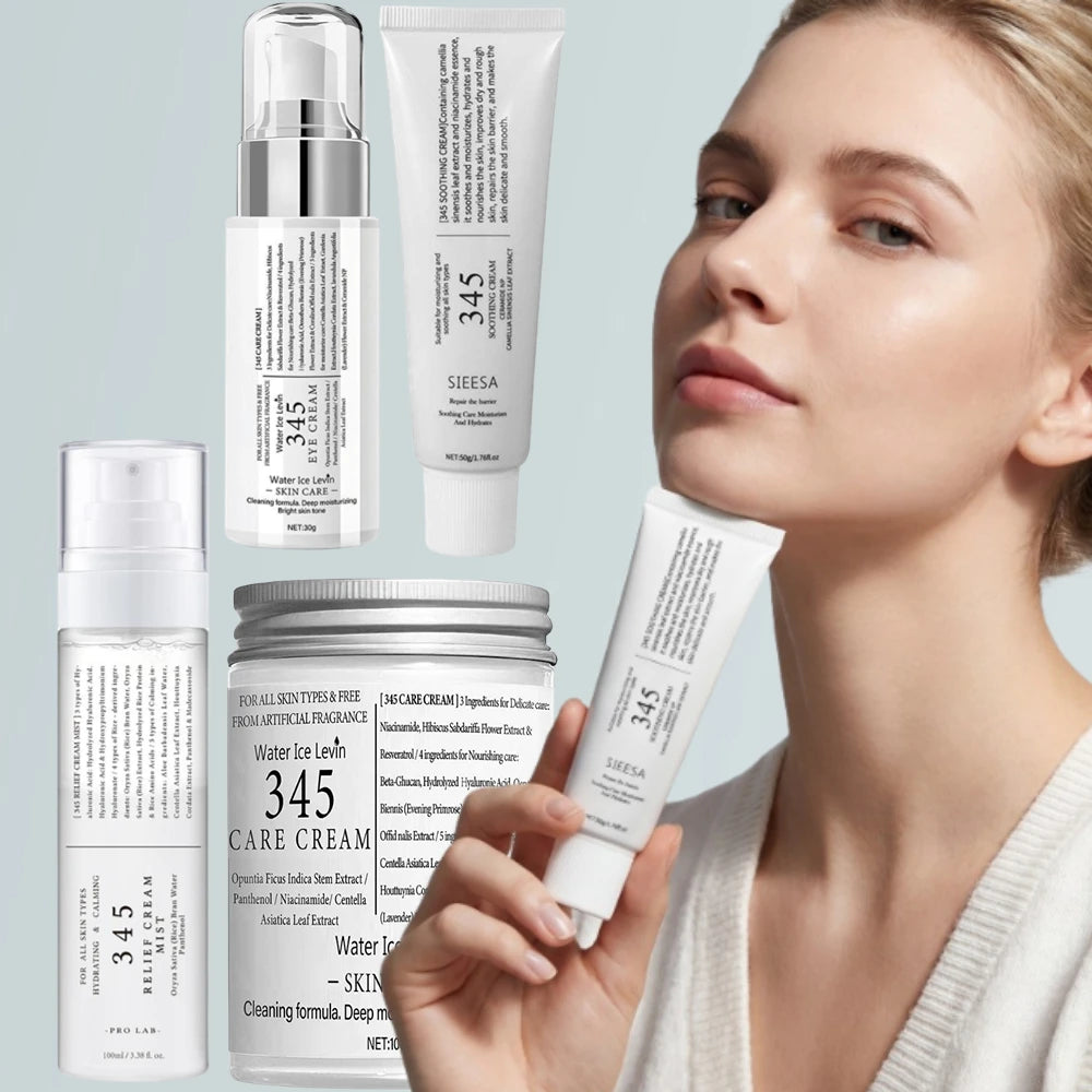 A woman with glowing skin holding a range of white skincare bottles and tubes for hydration and soothing care.