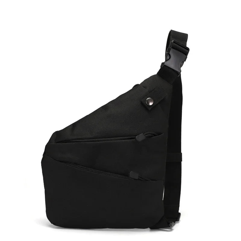 Black, compact anti-theft sling bag with a slim silhouette, adjustable strap, side-release buckle, and zipped pockets.