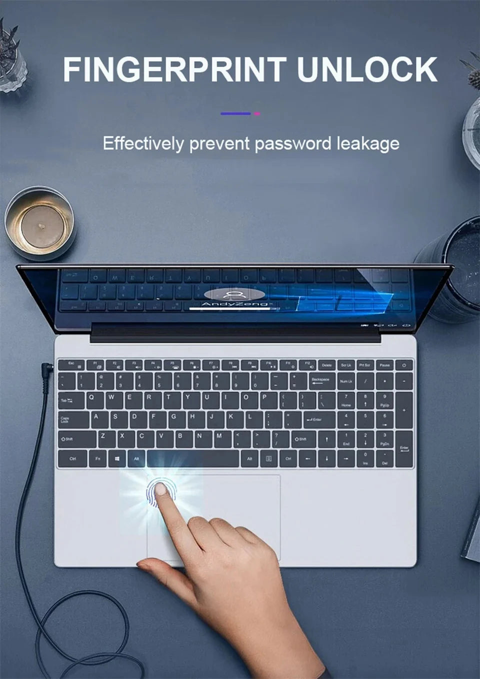 Top-down view of a silver 15.6-inch laptop with a numeric keypad, showing a finger using the trackpad fingerprint sensor.