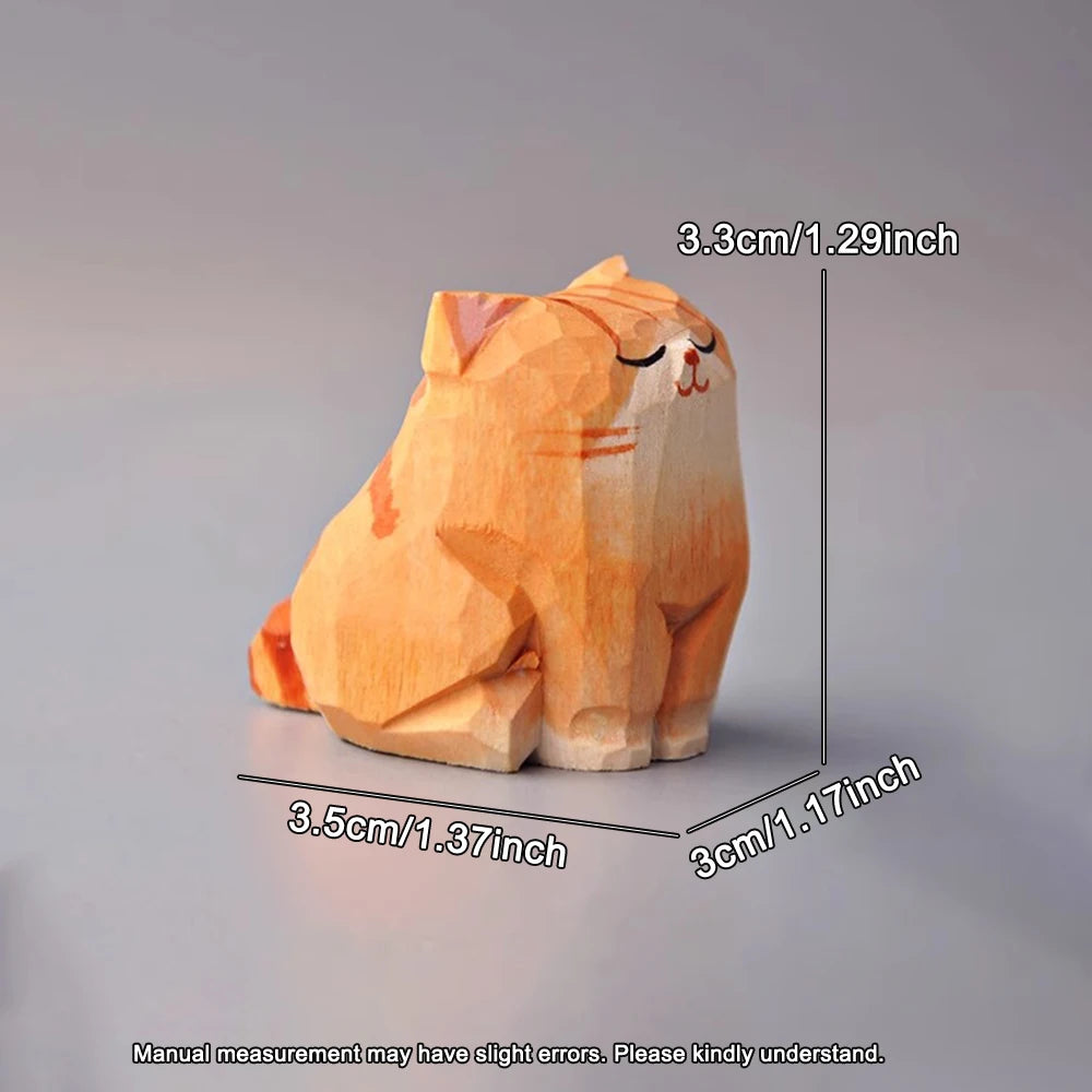 Hand-carved wooden orange tabby cat figurine with a cute, faceted geometric style and a sleepy expression.