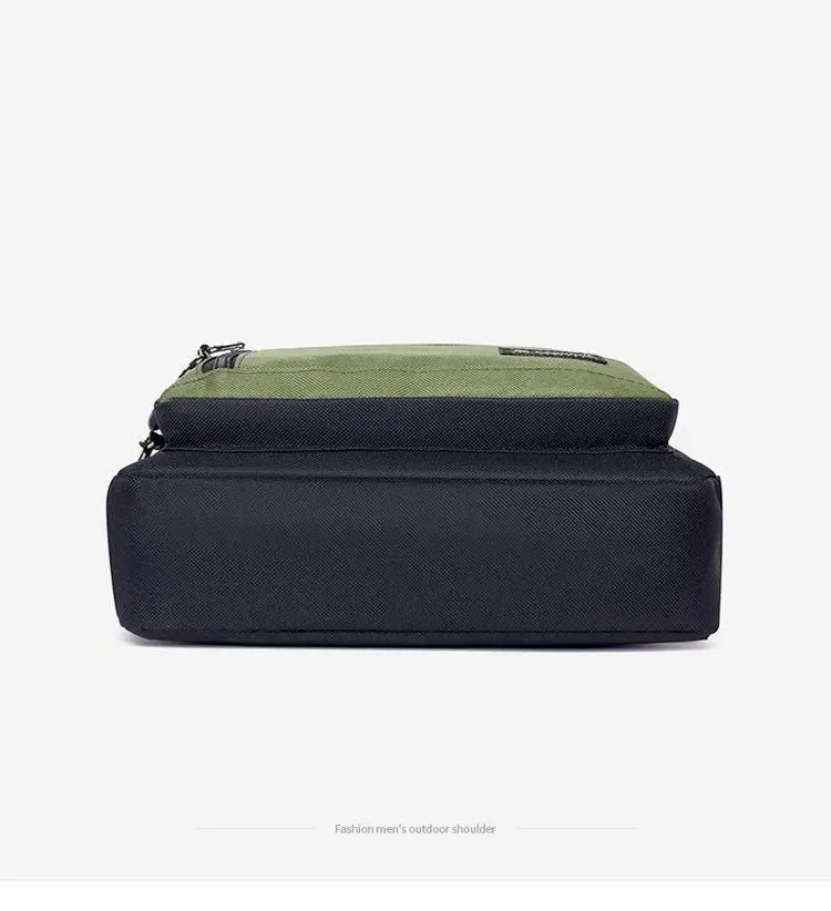 Men's olive green and black two-tone crossbody bag featuring a rectangular silhouette and zipped compartments.