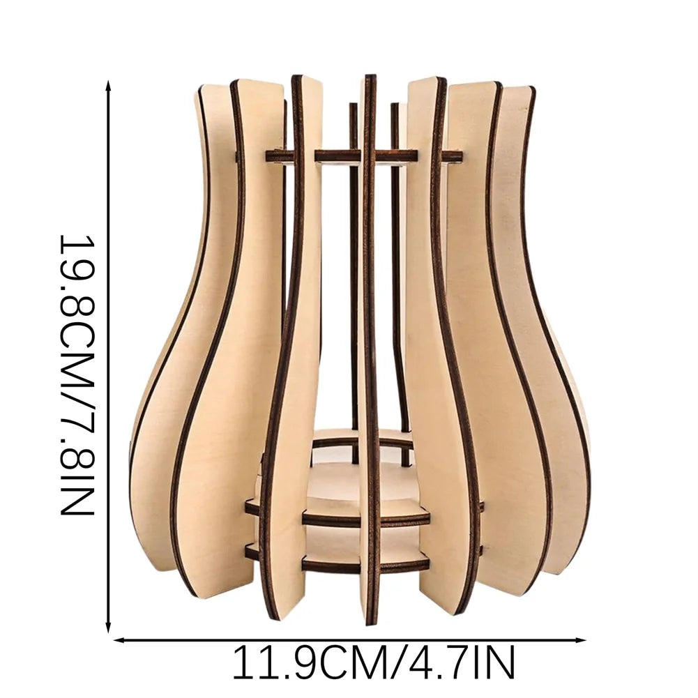 Decorative light-coloured wooden vase or lantern frame with a modern, curved slatted design. 19.8cm height.