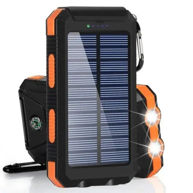 Rugged black and orange solar power bank with built-in LED torch, compass, and clip hook.