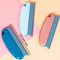 Three 15cm scrapers in blue, light blue, and pink, each with a grey handle and a serrated plastic edge.