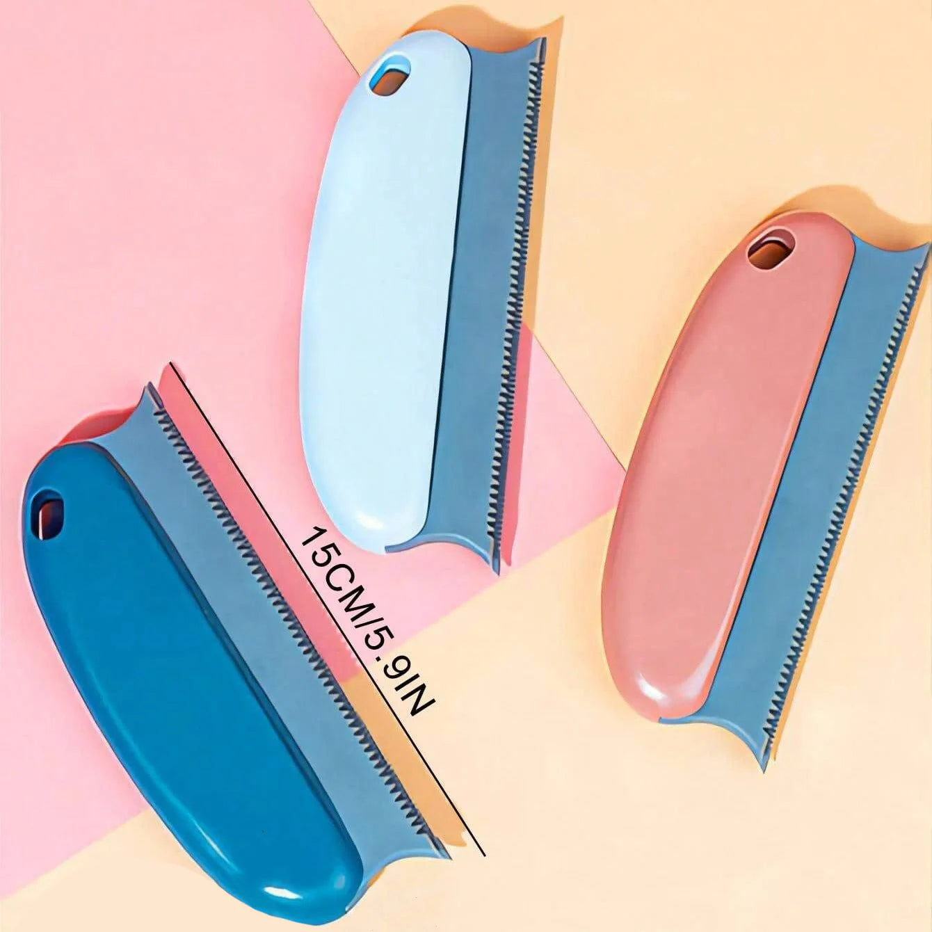 Three 15cm scrapers in blue, light blue, and pink, each with a grey handle and a serrated plastic edge.