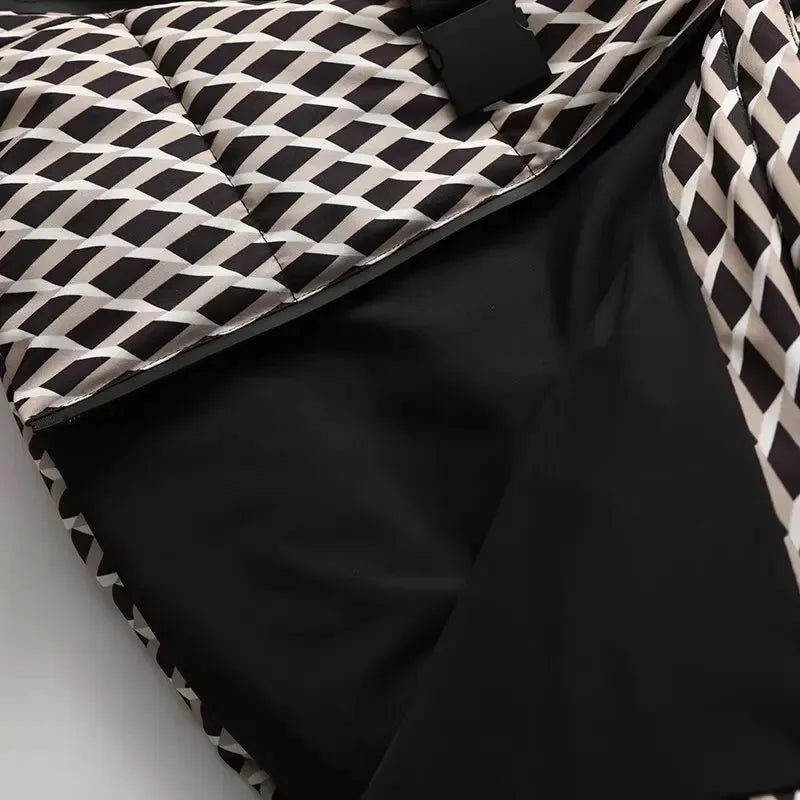 Quilted jacket featuring a black and beige geometric diamond pattern, contrast plain black lining, and a buckle detail.