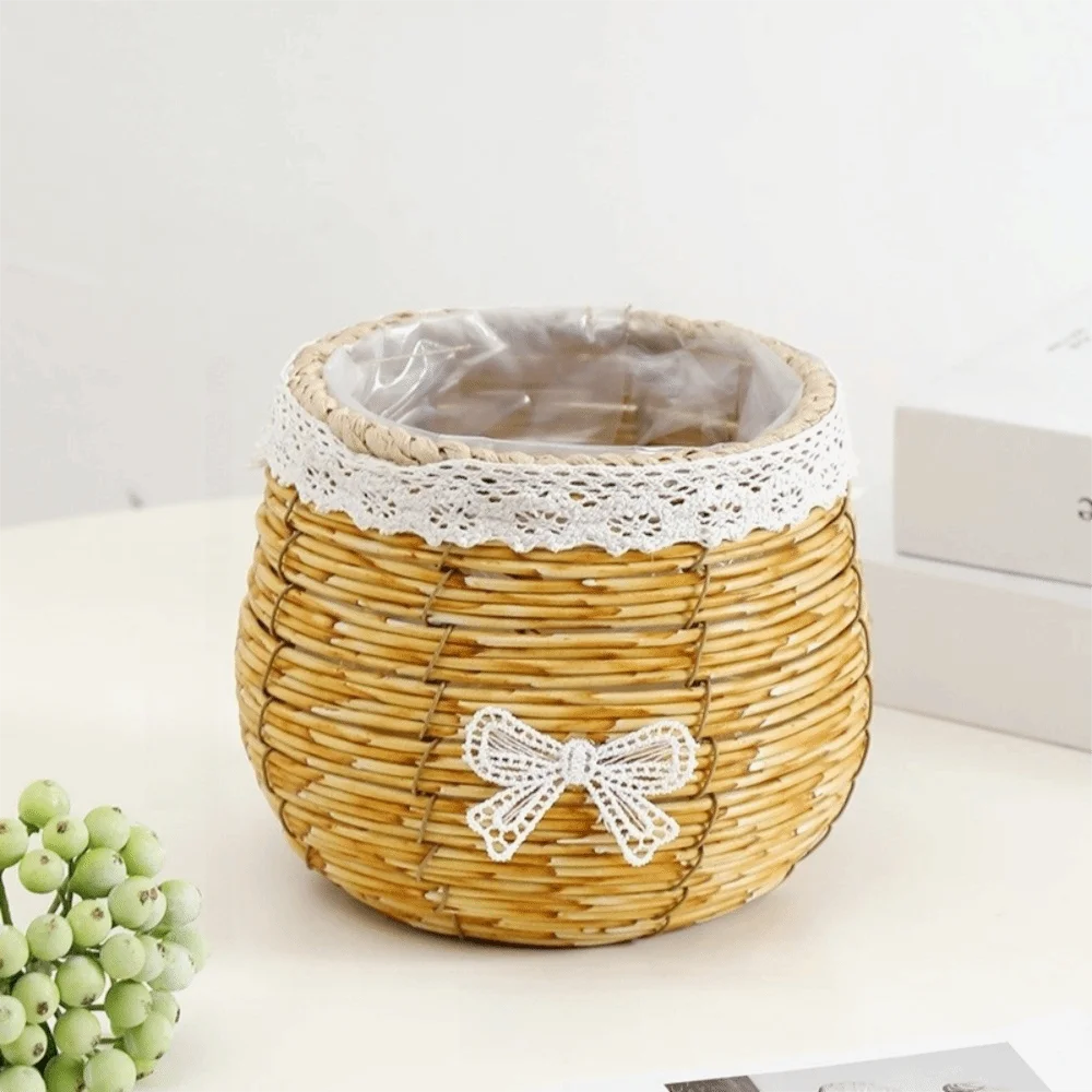 Rustic woven light-brown basket with a white lace trim and bow, featuring a clear plastic liner for plant display.