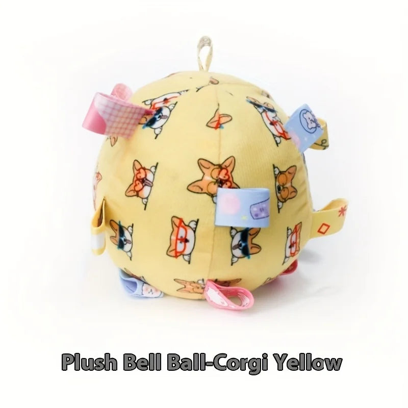 Yellow plush dog ball with a cute corgi print and colourful fabric sensory tabs for interactive play.