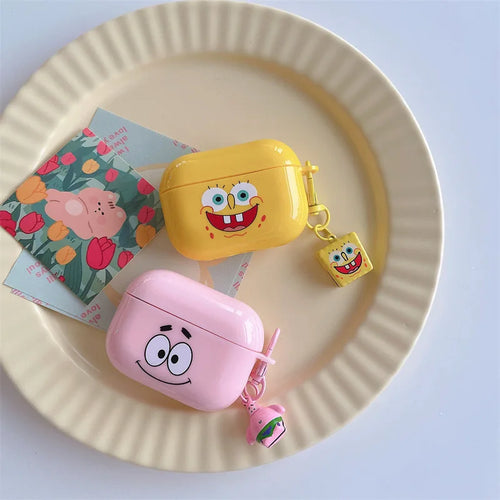 SpongeBob and Patrick silicone AirPods Pro cases in yellow and pink, featuring character keychains.