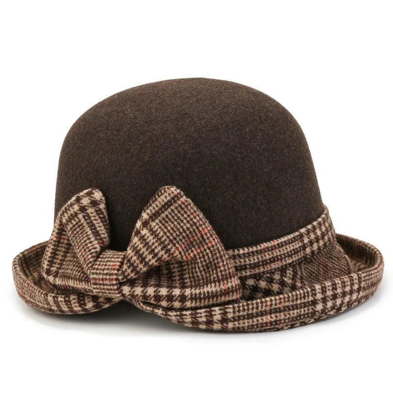 Dark brown felt bucket hat with a turned-up brim featuring a brown and cream checked pattern and a decorative bow.