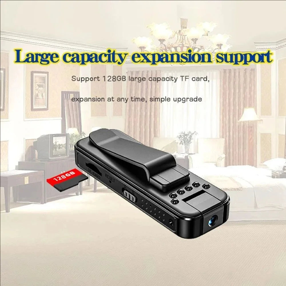 Black plastic wearable body camera with a clip and a 128GB TF card inserted on the side.