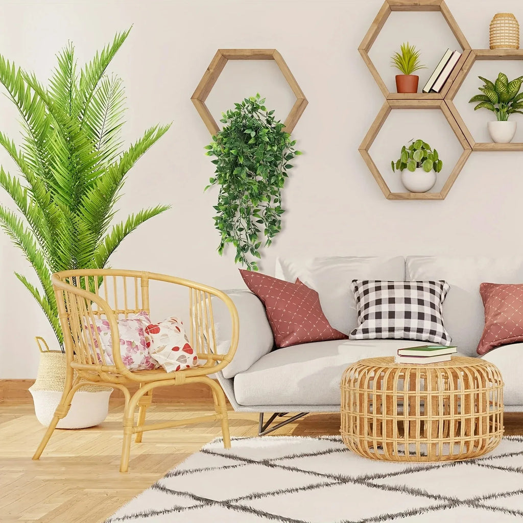 Artificial ivy plant hanging from a hexagonal wall shelf in a cozy living room with rattan furniture and decor.