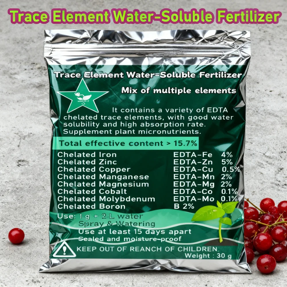 Shiny silver and dark green pouch of water-soluble trace element fertilizer for plants on a grey surface.