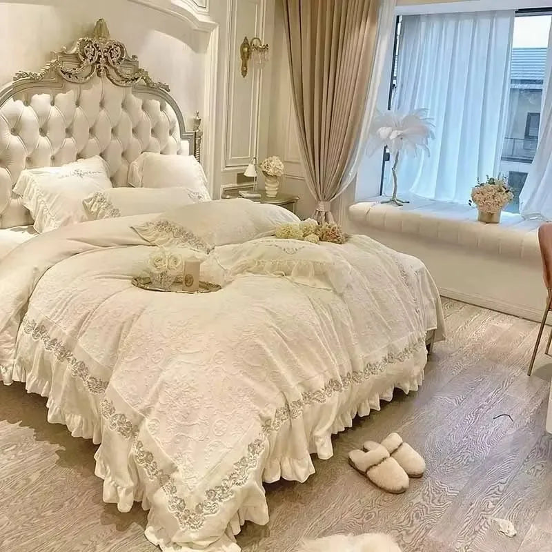 Cream Italian-style double bed frame with an ornate, button-tufted headboard and matching ruffled bedding.