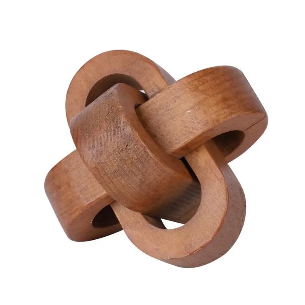 Decorative wooden knot sculpture in a natural light brown finish, featuring an interlocking looped design.