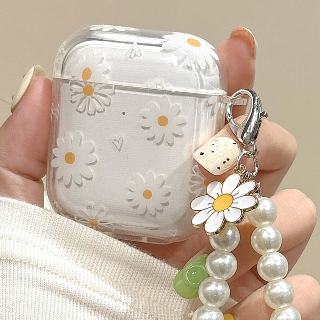 Clear AirPods case with white daisy pattern and pearl charm attachment, suitable for Apple AirPods.