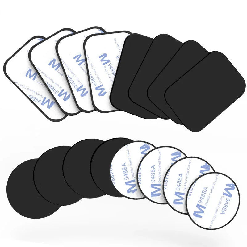A set of black double-sided adhesive tape squares and circles with white protective backings.