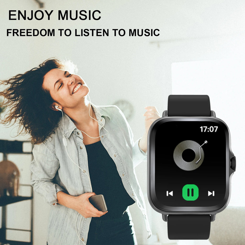 Black smart watch with square screen displaying music controls, worn by a woman enjoying music in the background.