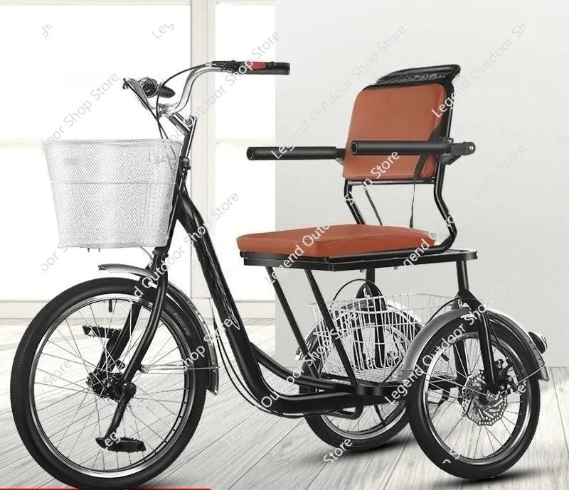 Black adult tricycle with brown padded seat, backrest, armrests, and two wire storage baskets.