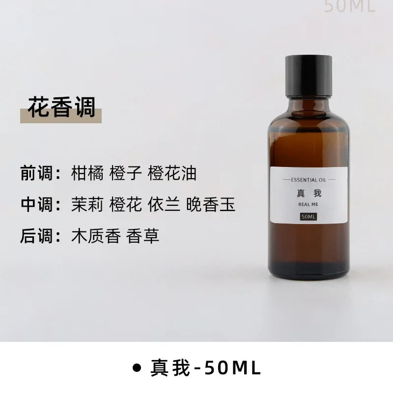 50ml amber glass bottle of floral-scented essential oil with a minimalist black cap and simple white label.