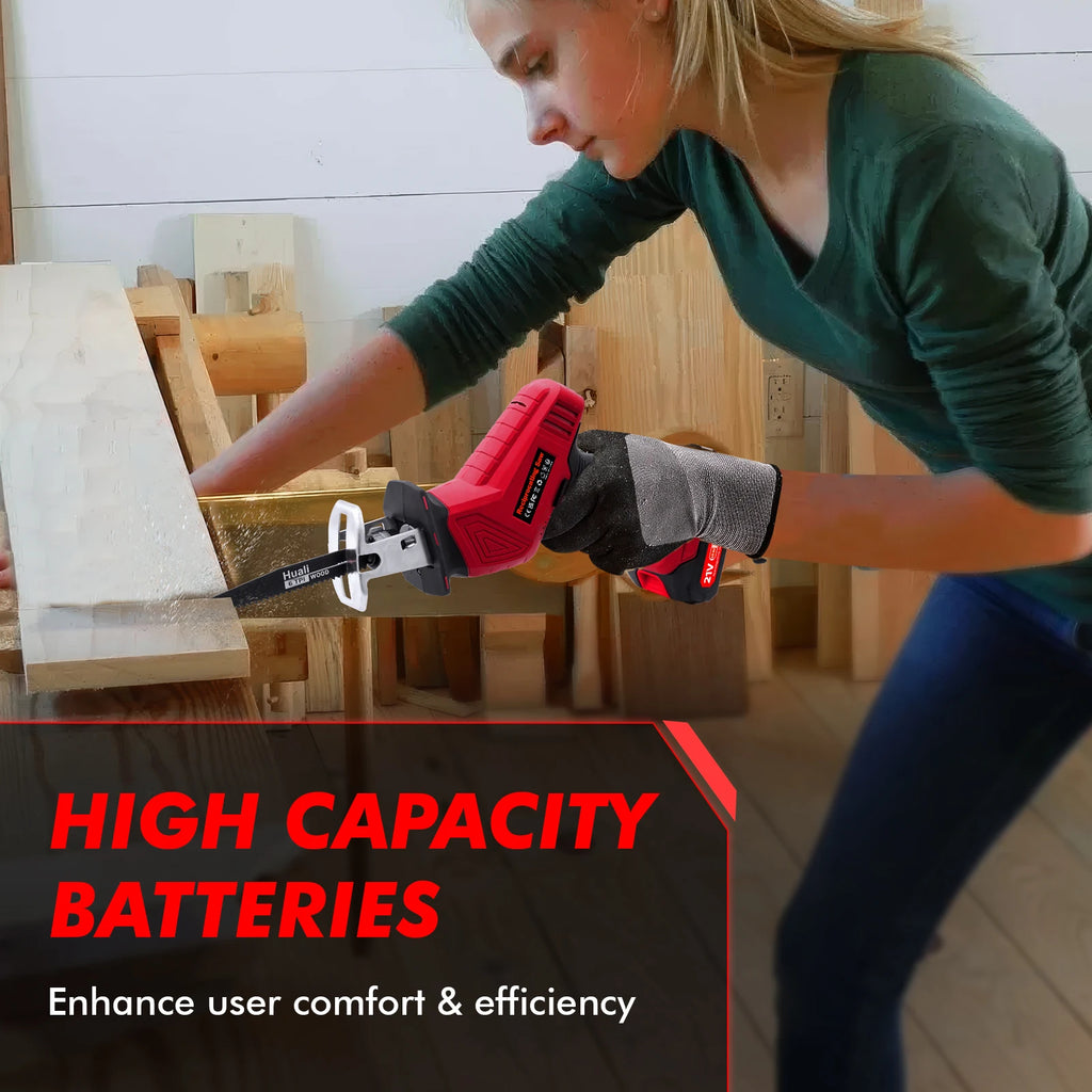 Woman cuts wood plank with a red electric reciprocating mini saw, wearing gloves.