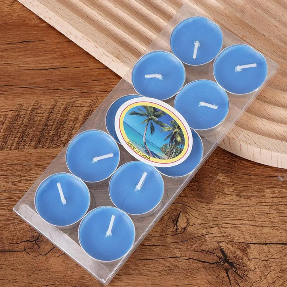 Pack of ten light blue tea light candles in clear plastic packaging, displayed on a wooden surface.