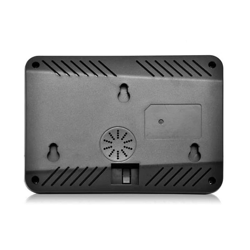 Black rectangular plastic back of a digital clock or monitor with wall mount holes, speaker vents, and battery door.