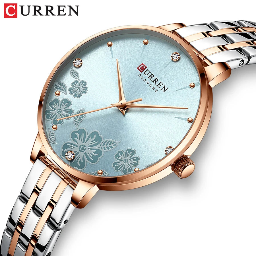 Curren women's quartz watch with light blue floral dial, rose gold case, and silver-gold metal strap.