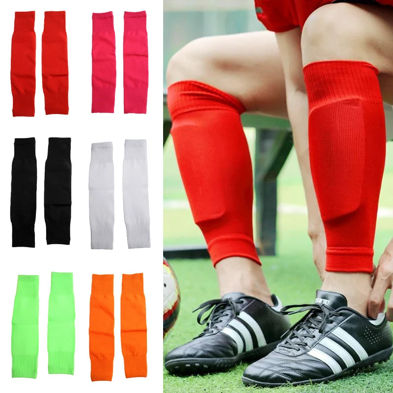 Football shin guard sleeves available in multiple colours, featuring a secure, supportive fit for sports protection.