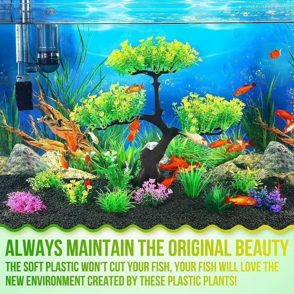 Artificial aquarium tree with yellow foliage, surrounded by colorful plastic plants and fish in a gravel-bottom tank.