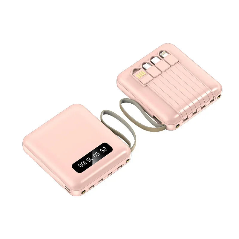 Two blush pink mini power banks with digital battery displays and integrated charging cables for portable power.