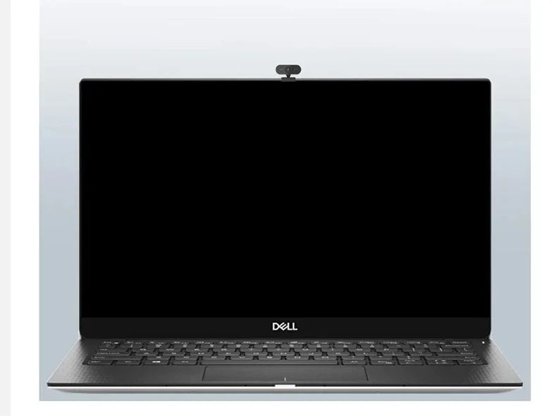 Compact black 1080p HD webcam with built-in microphone, mounted on top of a slim laptop screen.
