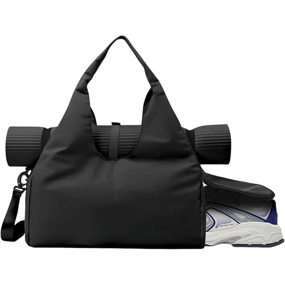A black gym bag with a rolled yoga mat through handles and a sneaker in a side compartment.