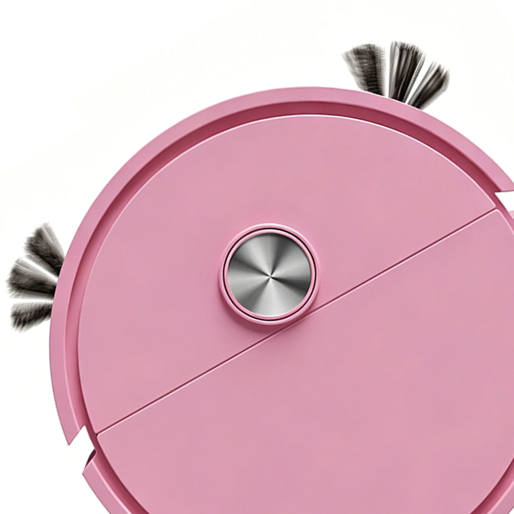 A top-down view of a pink robotic vacuum cleaner on a white background, featuring a metallic center dial and two side brushes.