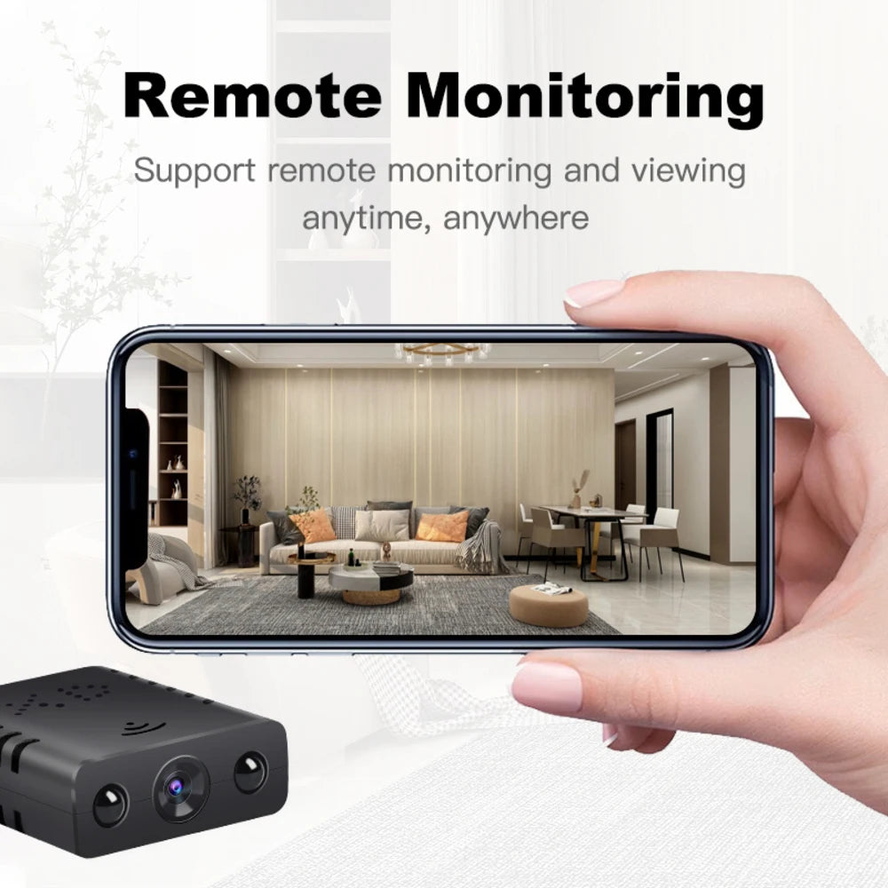 A small black plastic wireless security camera being monitored via a smartphone app.
