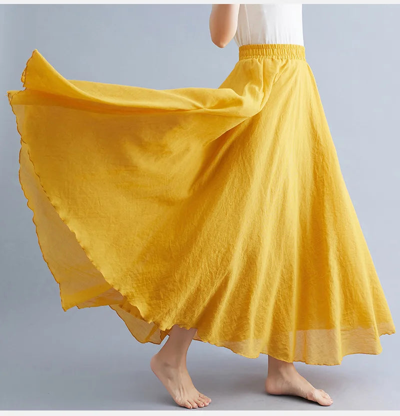 Flowing mustard yellow maxi skirt with an elasticated waistband, featuring a full, lightweight silhouette.