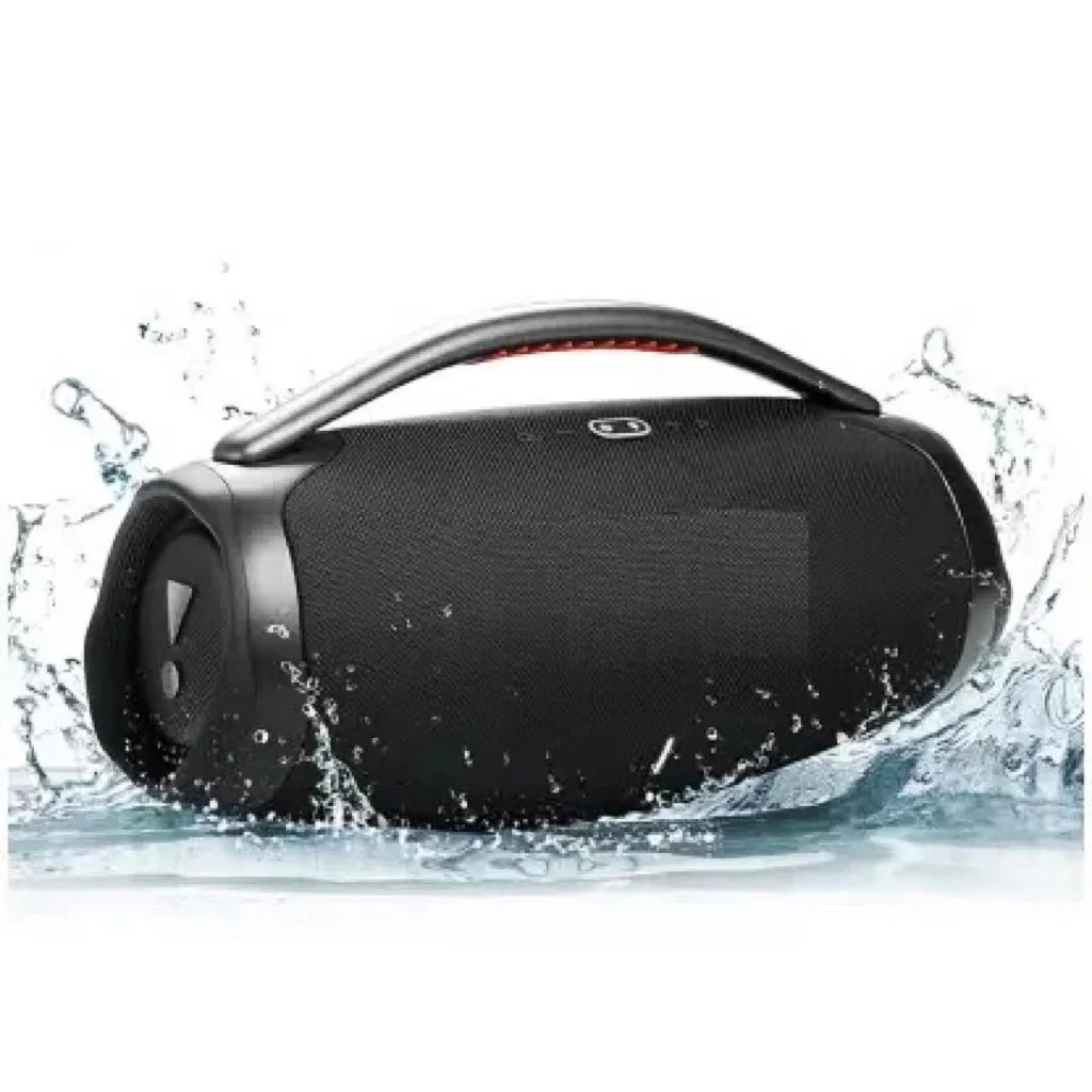 Black portable Bluetooth speaker with a top carry handle, surrounded by water splashes, showcasing a sleek, rugged design.