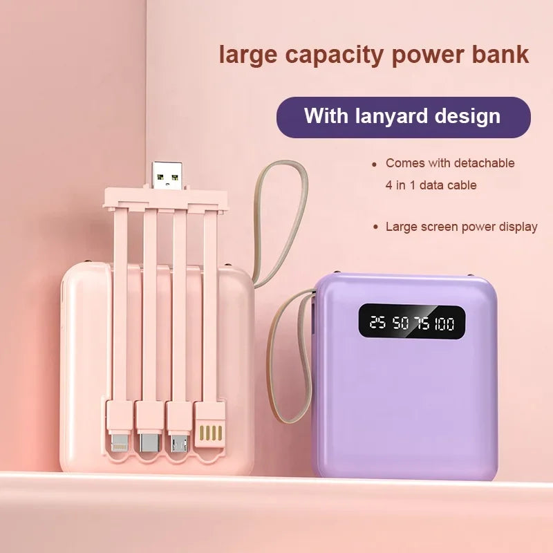 Pink and purple mini power banks with integrated 4-in-1 charging cables, lanyard, and digital battery display.