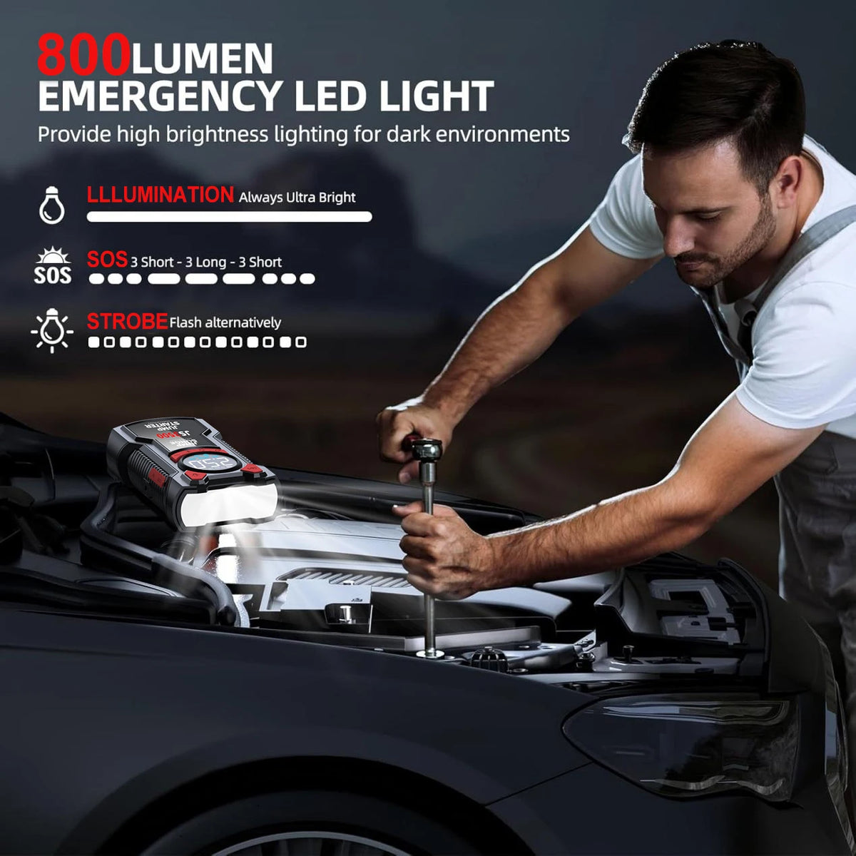 Black jump starter and air compressor resting under a car hood, illuminating the engine with its bright LED flashlight.