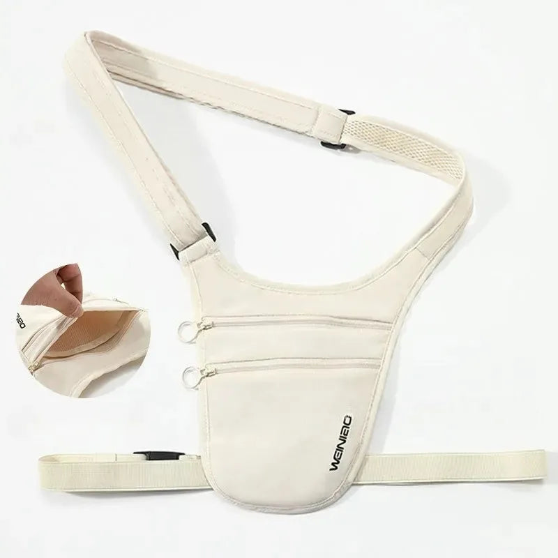Cream-coloured anti-theft crossbody travel pouch with an adjustable strap, zip pockets, and a mesh-lined compartment.