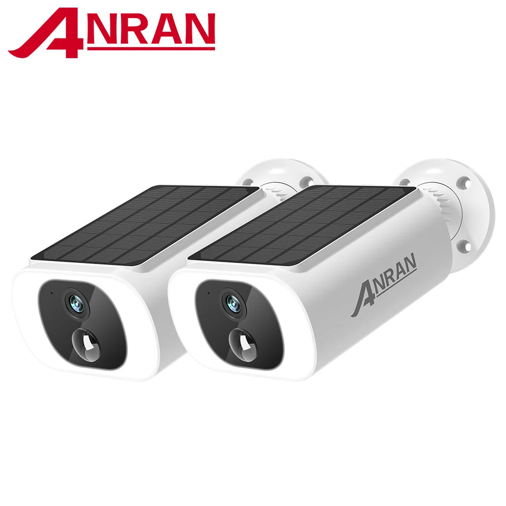 Two white ANRAN security cameras with integrated solar panels on top, angled forward against a white background.