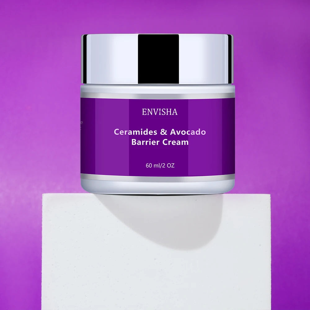 60ml jar of Ceramides & Avocado barrier cream with a purple label and silver lid, displayed on a white block.