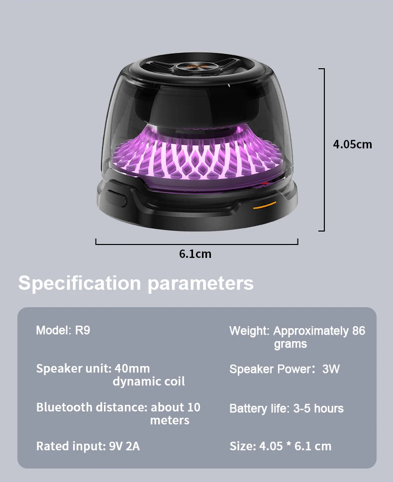 Small, black, portable Bluetooth speaker with a transparent casing and a glowing purple internal light.