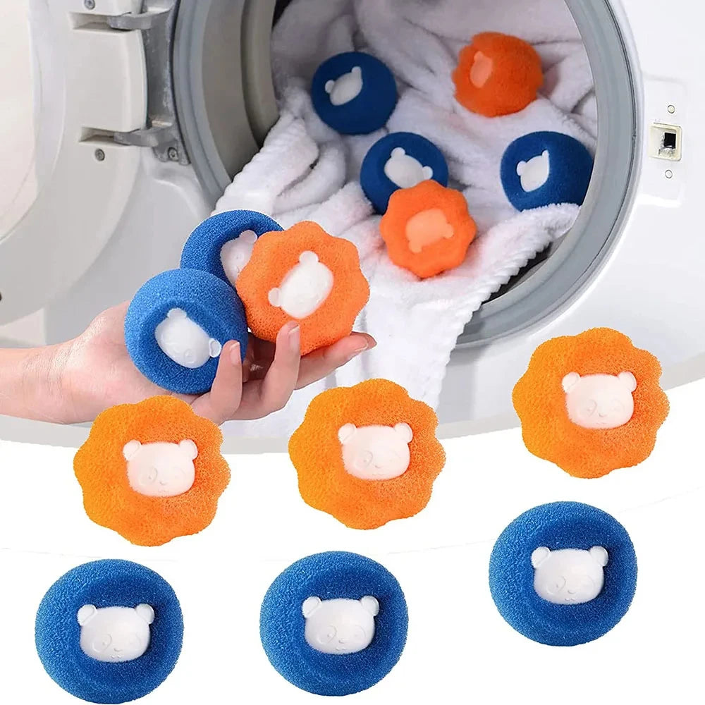 Hand holding blue and orange sponge laundry balls with cute white bear faces, shown with a washing machine background.