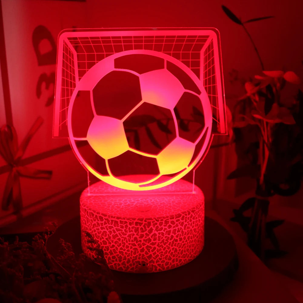 Red 3D optical illusion LED lamp featuring a football and goal, set on a textured circular base.