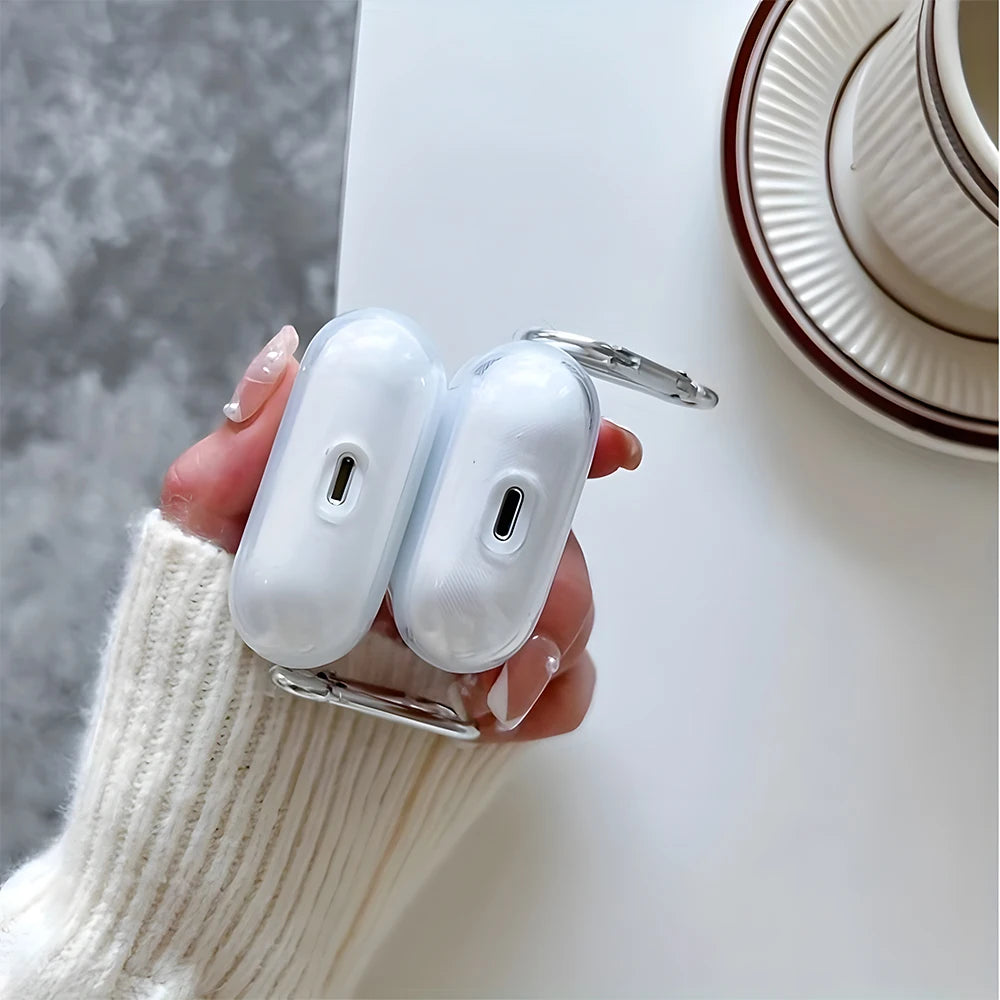 Clear protective case for AirPods Pro, featuring a side carabiner, held in a hand.