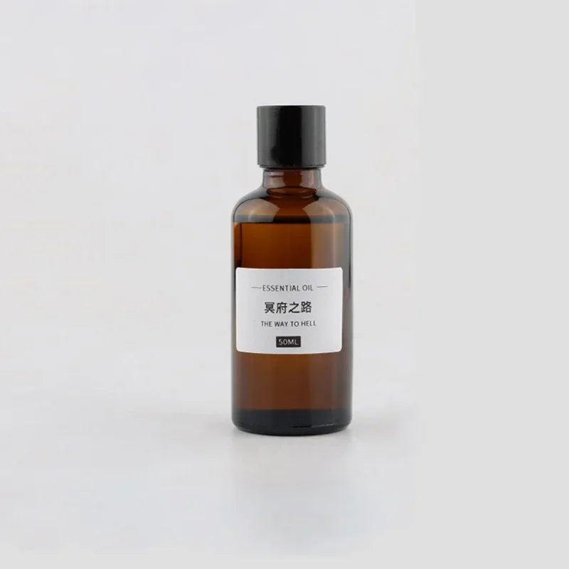50ml amber glass bottle of essential oil with a minimalist white label, black cap, and neutral background.