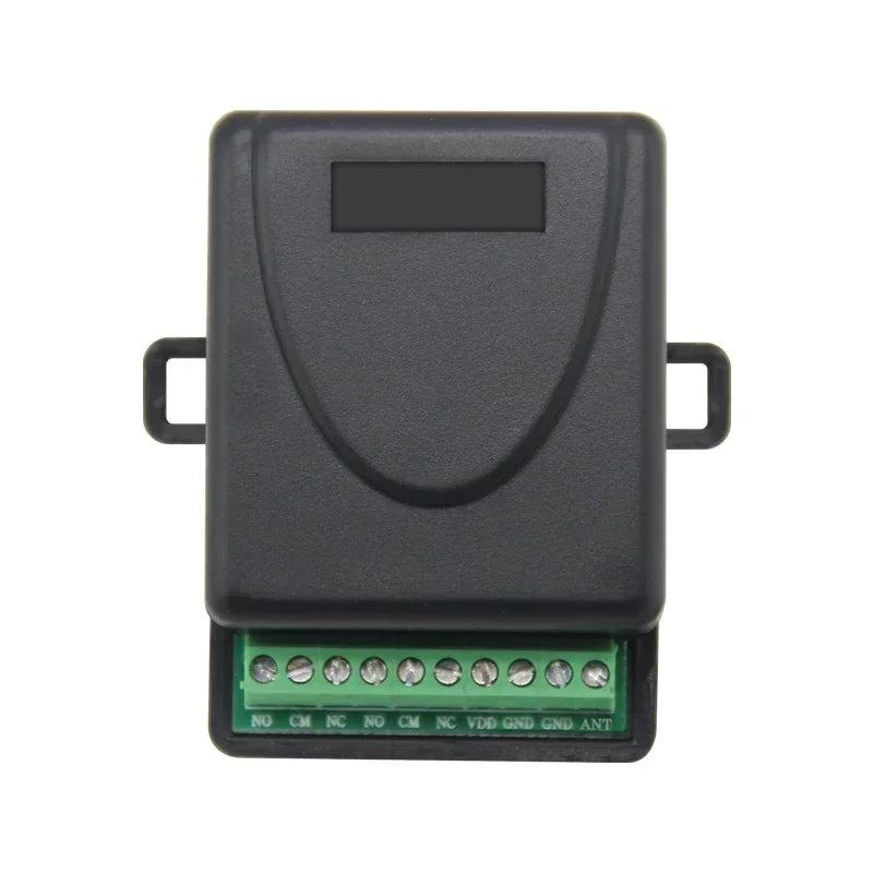 Black plastic electronic relay module with green terminal block and screw connections, isolated on white background.