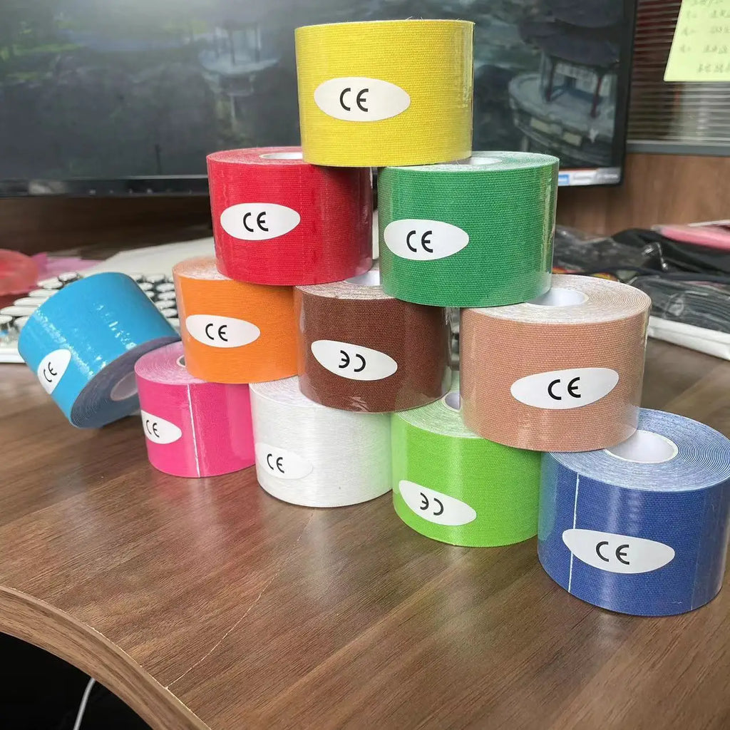 A stack of colourful kinesiology tape rolls, each featuring a white CE-marked label.
